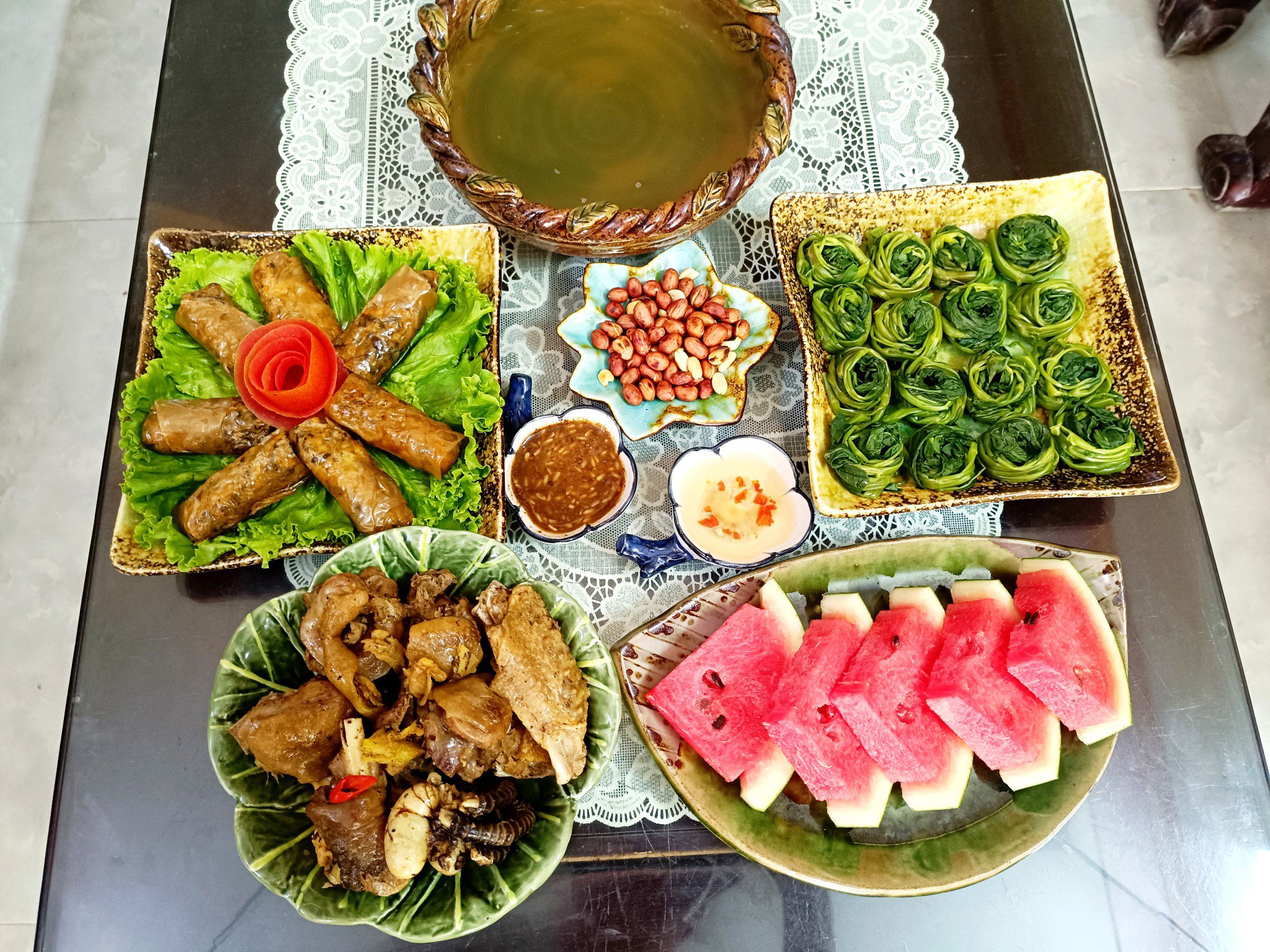 Gà rang mắm gừng - Nem rán - lạc rang - Rau muống luộc - Dưa hấu